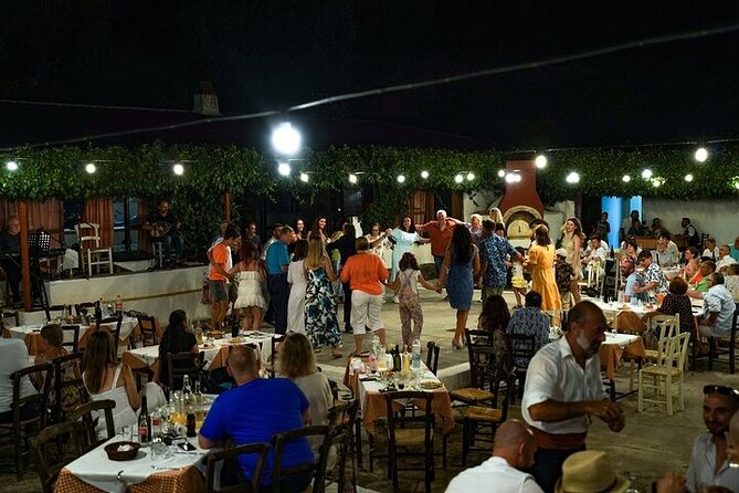 Cretan gastronomy and folklore under the evening sky